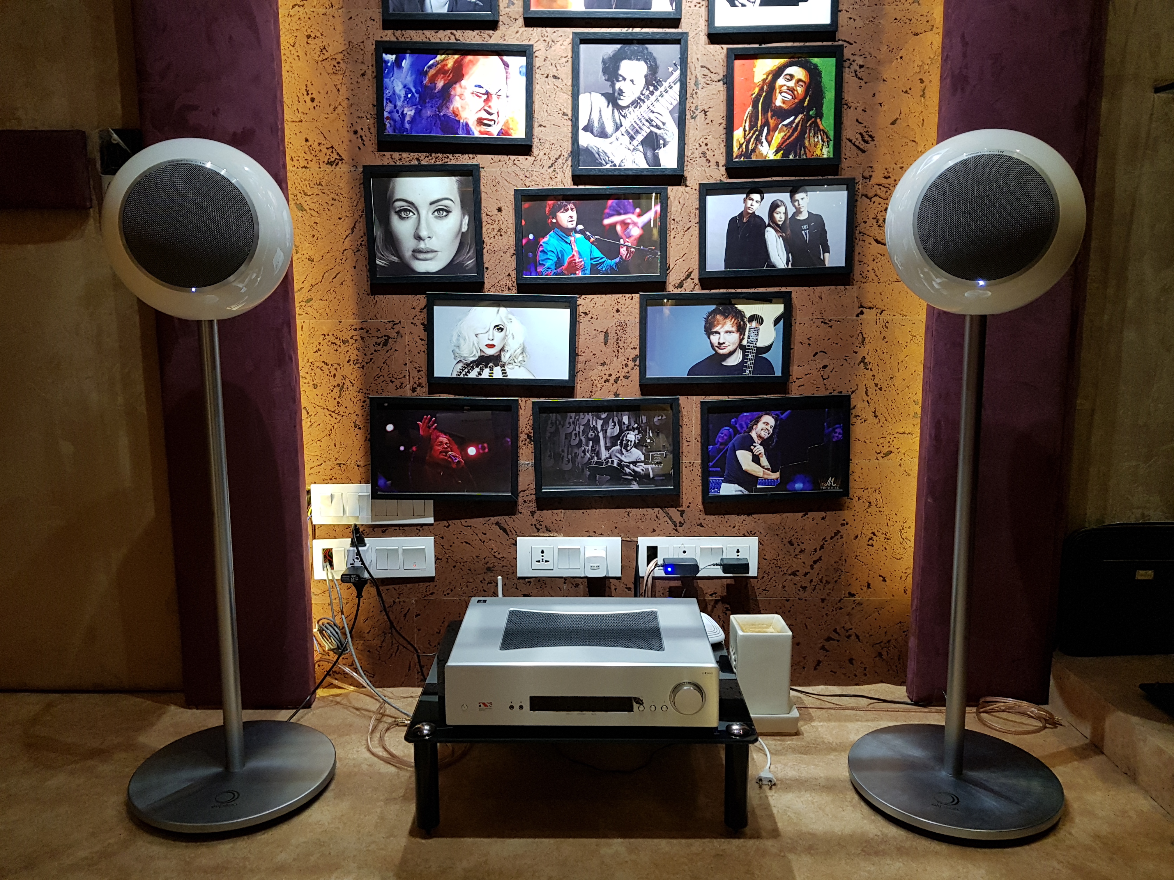 Speaker wall with curated album art at the Southern Avenue demo flat